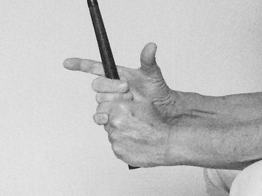 Illustration of hand and finger placement on a golf grip