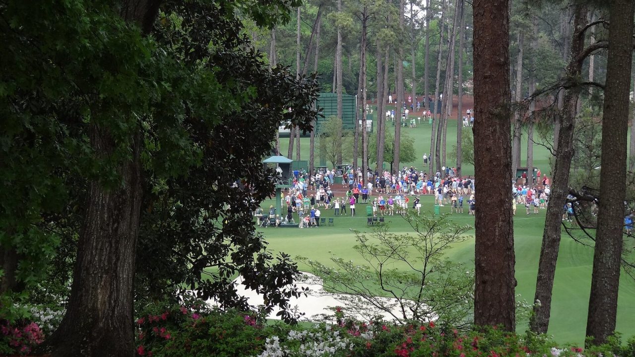 Spectators around a green at Augusta National during 2015 Masters practice